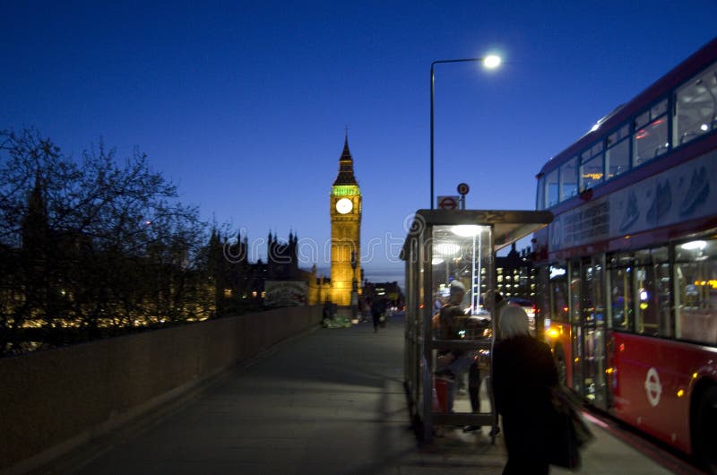 London night with Big Ben and double decker bus stock images