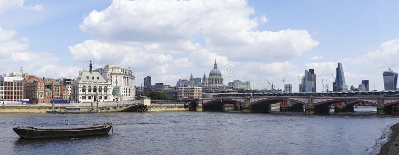 London, United Kingdom - June 01, 2014: View to the Tower bridge and the river Thames. London, United Kingdom - June 01, 2014: View to the Tower bridge and the river Thames.