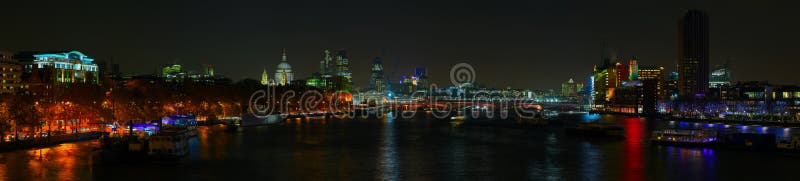 London skyline over the River Thames at night