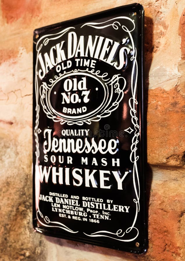 LONDON, UK - AUGUST 31, 2018: Jack Daniels retro vintage steel display plate on brick wall. stock photo LONDON, UK - AUGUST 31, 2018: Jack Daniels retro vintage steel display plate on brick wall. stock photo
