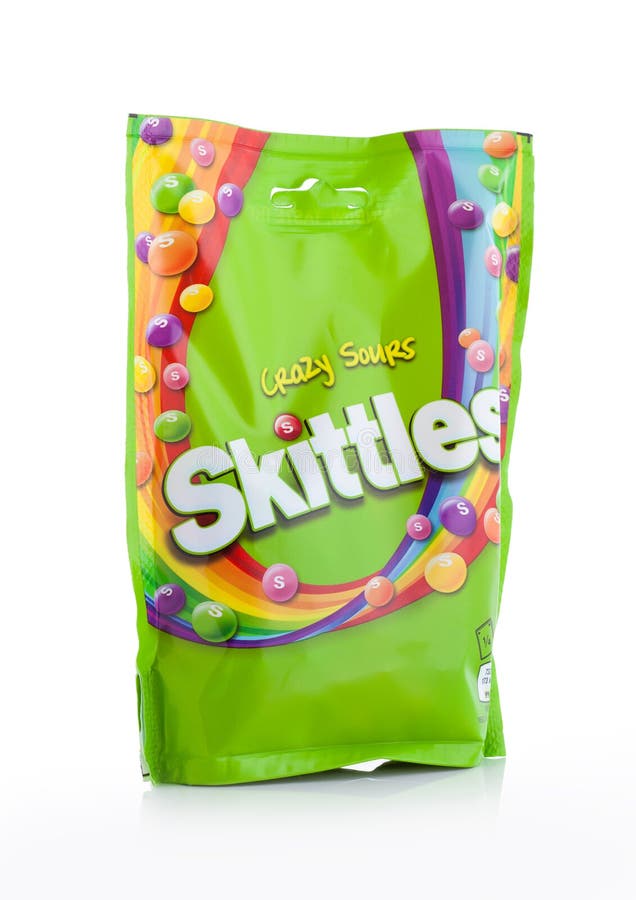 LONDON, UK -DECEMBER 07, 2017: Skittles Candy Pack Crazy Sours on white background. Skittles is a brand of fruit flavoured sweets. LONDON, UK -DECEMBER 07, 2017: Skittles Candy Pack Crazy Sours on white background. Skittles is a brand of fruit flavoured sweets.