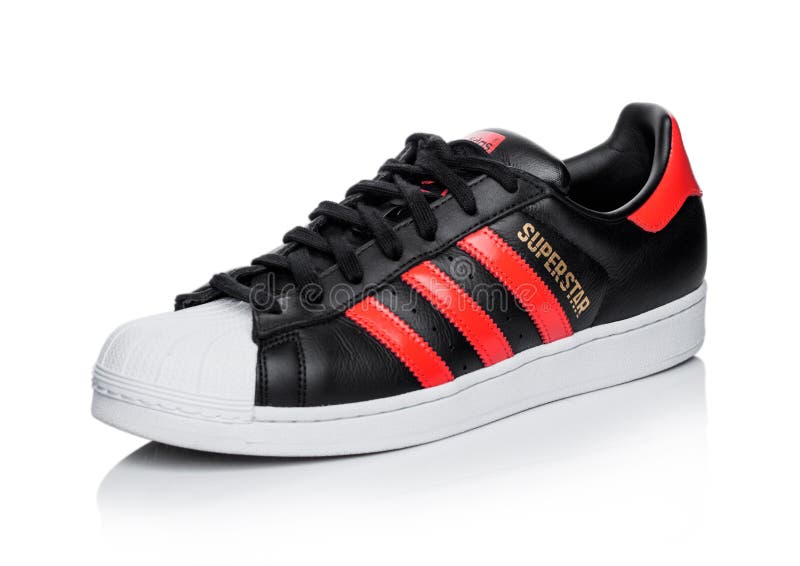 UK - JUNE 05, 2019: Adidas Originals Superstar Black Shoe with Red Stripes on White Multinational Editorial Photo - Image of falsification, clothes: 149858836