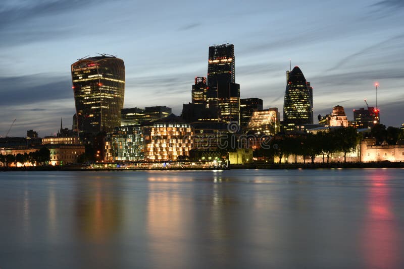 London UK, Majestic iconic London Skyscrapers 20 Fenchurch Street, Leadenhall, 30 st Mary Axe or Gherkin buildings at night stock photo London UK, Majestic iconic London Skyscrapers 20 Fenchurch Street, Leadenhall, 30 st Mary Axe or Gherkin buildings at night stock photo