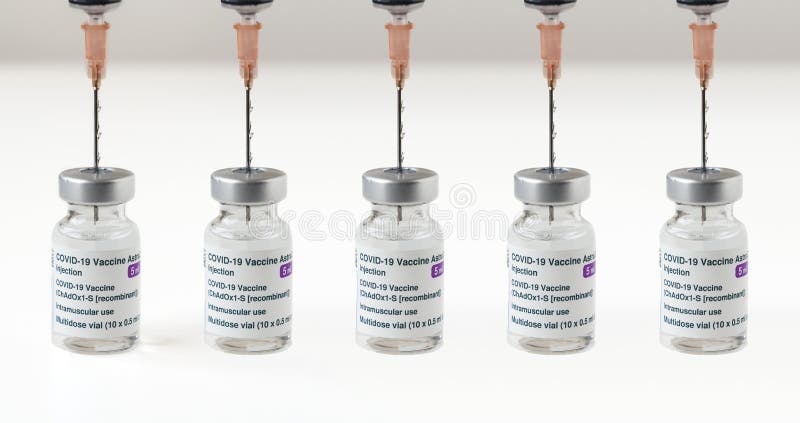 London, UK - 08 Mar 2021: Close up to seamless pattern of Covid vaccines. Production concept and mass vaccination