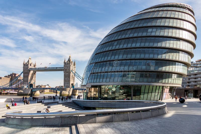 LONDON/UK - MARCH 7 : View of City Hall and Tower Bridge in London on March 7, 2015. Unidentified people.