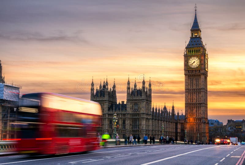 London, the UK. Red bus in motion and Big Ben, the Palace of Westminster. The icons of England. London, the UK. Red bus in motion and Big Ben, the Palace of Westminster. The icons of England