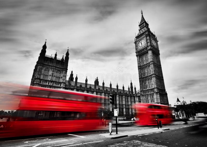 London, the UK. Red buses in motion and Big Ben, the Palace of Westminster. The icons of England in black and white with red colour. London, the UK. Red buses in motion and Big Ben, the Palace of Westminster. The icons of England in black and white with red colour.