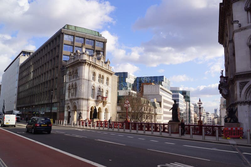 Dragon on Holborn Viaduct in the City of London with Goldman Sachs