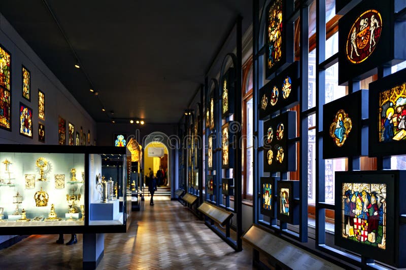 London, UK â€“ April 2018: Panels of stained and painted glass exhibited at Sacred Silver and Stained Glass room at the Whiteley Gallery in Victoria and Albert Museum. London, UK â€“ April 2018: Panels of stained and painted glass exhibited at Sacred Silver and Stained Glass room at the Whiteley Gallery in Victoria and Albert Museum
