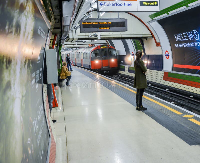 London Underground - girl waiting for her train