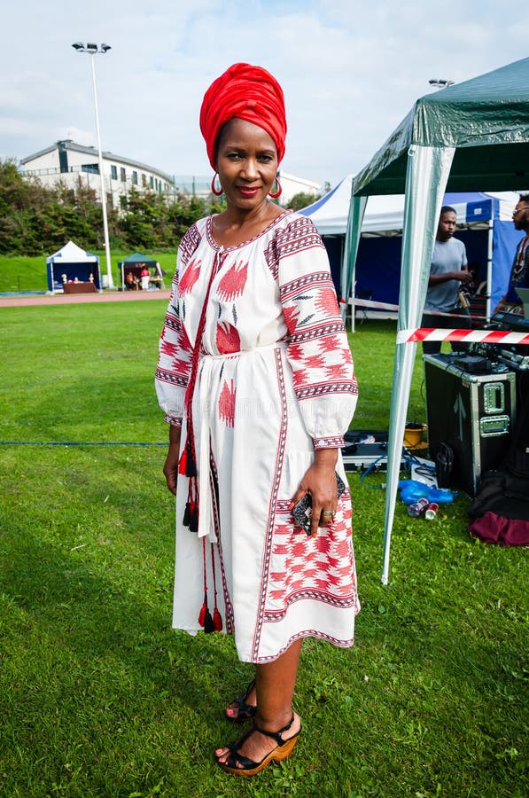 Frikan Cultural Festival fashion show. London, united kingdom - 26 August 2017: Frikan Cultural Festival fashion show Afro-British female wearing a red royalty free stock photo Frikan Cultural Festival fashion show. London, united kingdom - 26 August 2017: Frikan Cultural Festival fashion show Afro-British female wearing a red royalty free stock photo