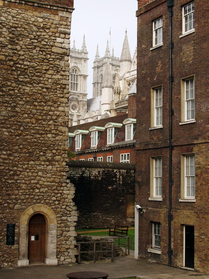 View of Westminster Abbey betwen old brick historical buildings in London, UK. View of Westminster Abbey betwen old brick historical buildings in London, UK.