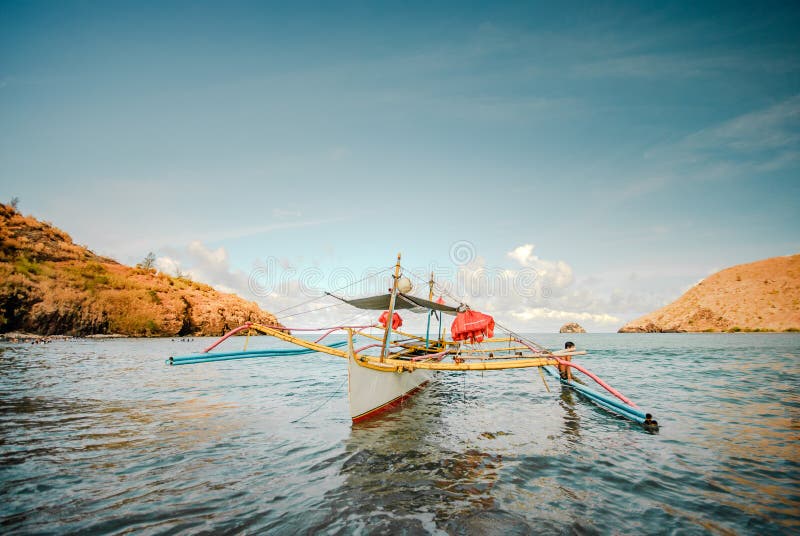 Lone boat at the shore of the beach at Zambales, Philippines