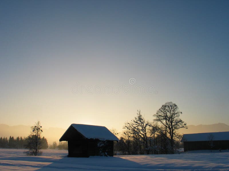 Lone Cottage in Snow Landscape with Sunset