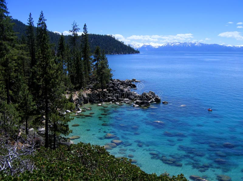 Lone kayaker on pretty Lake Tahoe royalty free stock images Lone kayaker on pretty Lake Tahoe royalty free stock images