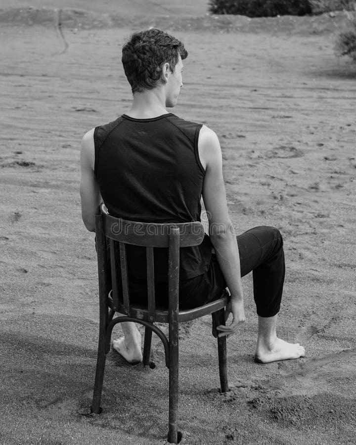 Lone Man Sitting on Chair in Desert Stock Photo Image of remote, rest 263974150