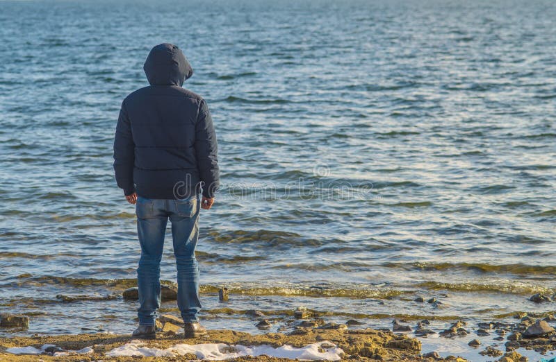 A Lone Man is Standing on an Empty Sea Beach Stock Photo - Image of ...