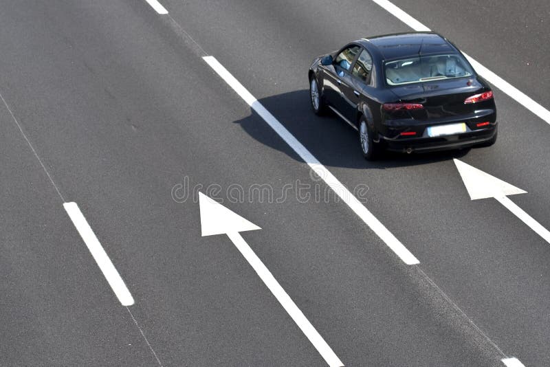 Lonely car in empty highway - landscape orientation