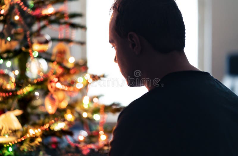 Lonely christmas with sad family conflict or grief on holiday. Man with stress, money problem or depression on Xmas.