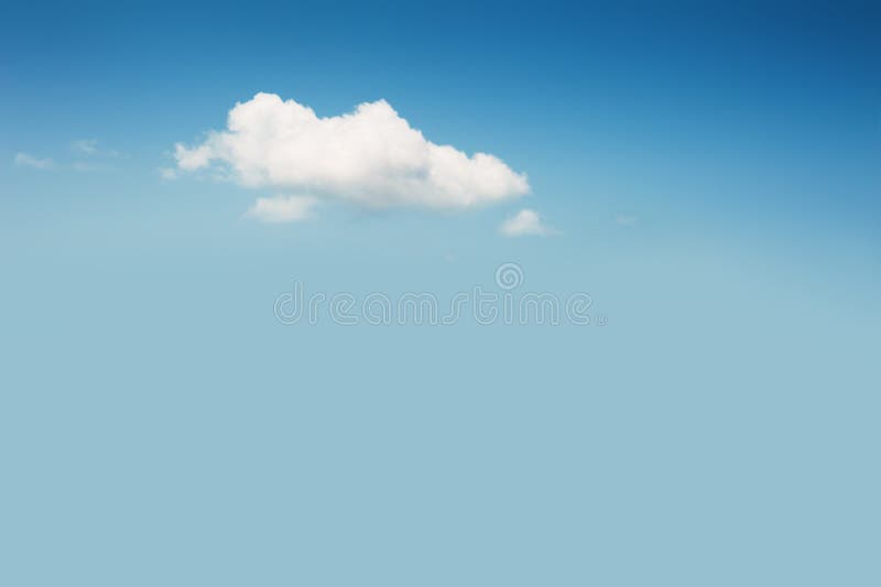 Lonely cloud in the blue sky. Abstract nature background stock image