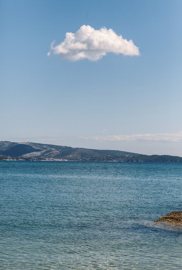 Lonely cloud on blue sky royalty free stock photography