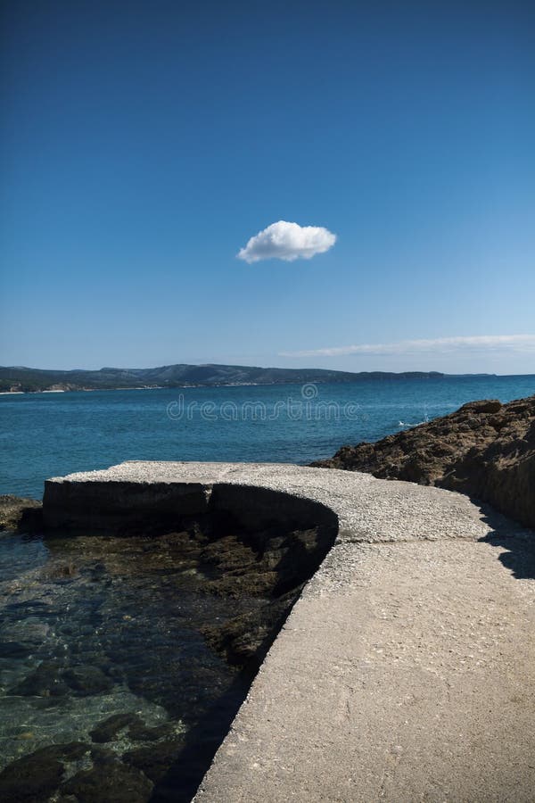Lonely cloud on blue sky stock photography