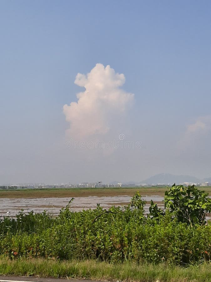 A lonely cloud in the sky. A bright sunny day. royalty free stock images