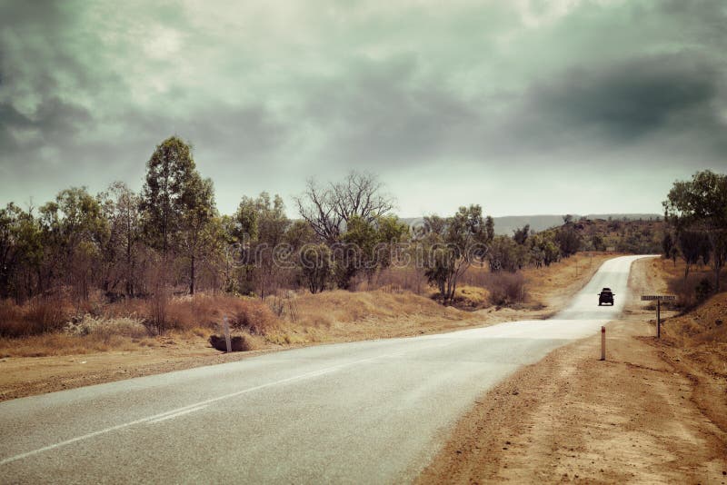 A lonely country road with one vehicle, in outback Western Australia, with an instagram effect. A lonely country road with one vehicle, in outback Western Australia, with an instagram effect.