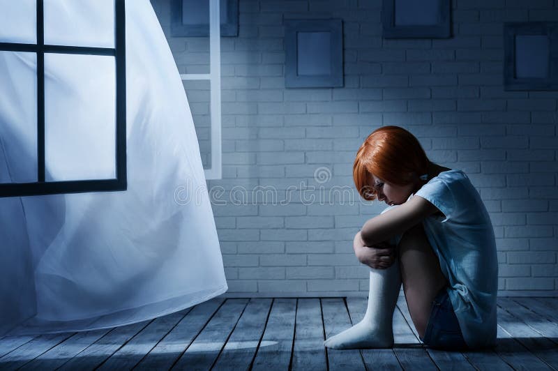 Lonely girl in a dark room stock image. Image of floor 32886349