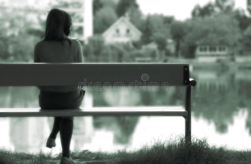 Lonely girl by the lake