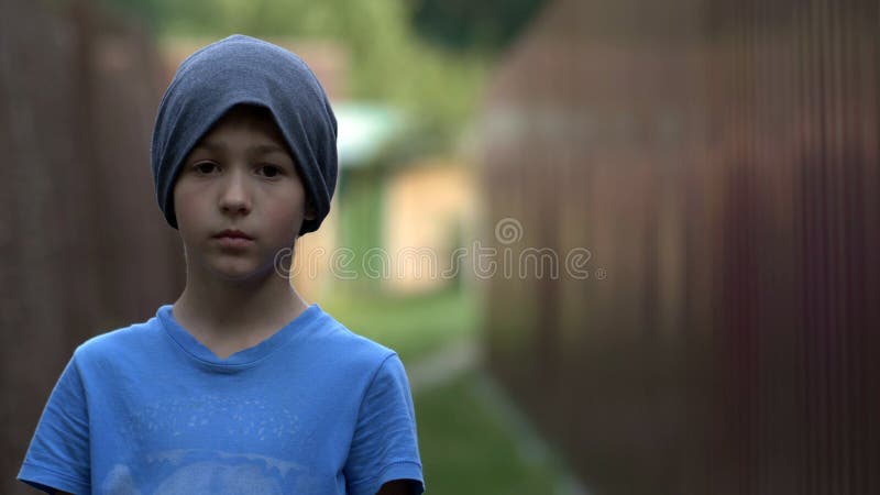 Lonely Homeless Teenage Boy Standing and Looking at the Camera Stock ...