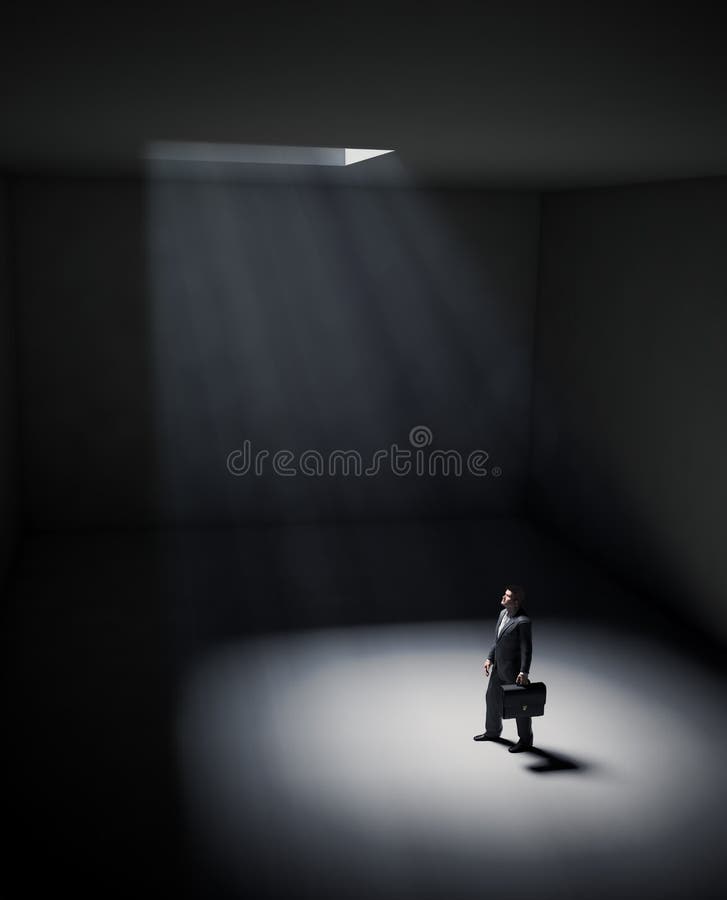 A lonely man standing in a spot of light
