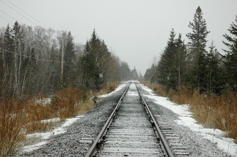 Lonely railroad tracks in snow