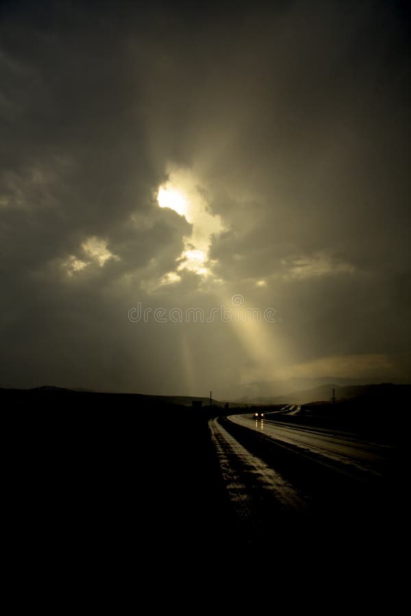 A single car on a dark road. A single car on a dark road