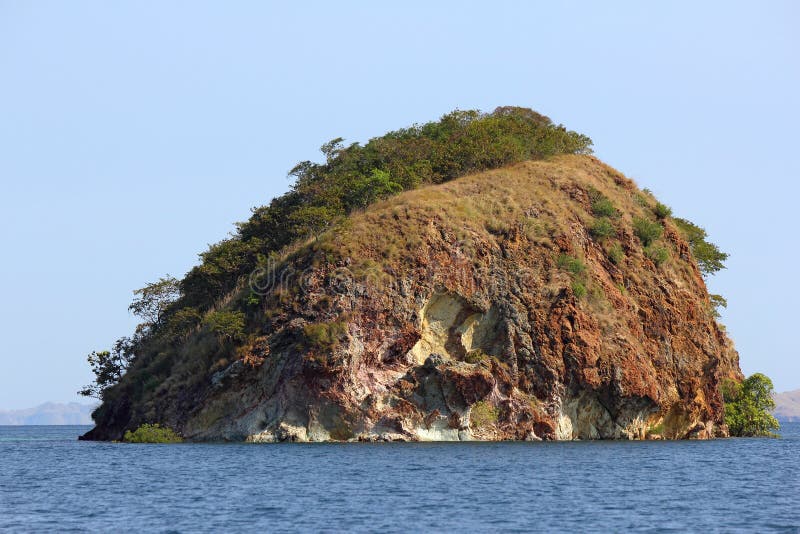 A lonely rocky island in the sea