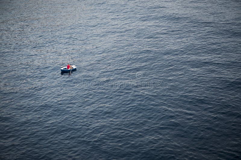 Lonely Rowboat on a Large Expanse of Sea