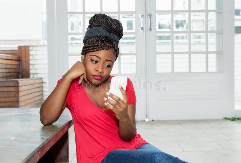 Lonely and sad african american woman waiting for message