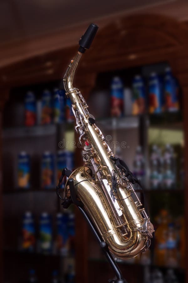Lonely Saxophone on the Bar. Stock Photo Image of instrument, cafe