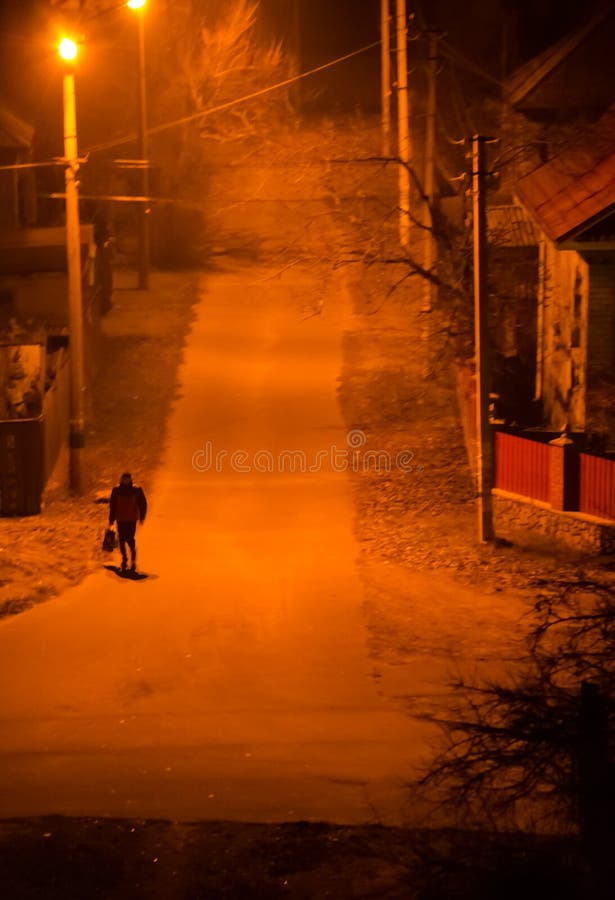 Lonely silhouette on a street in night stock photos