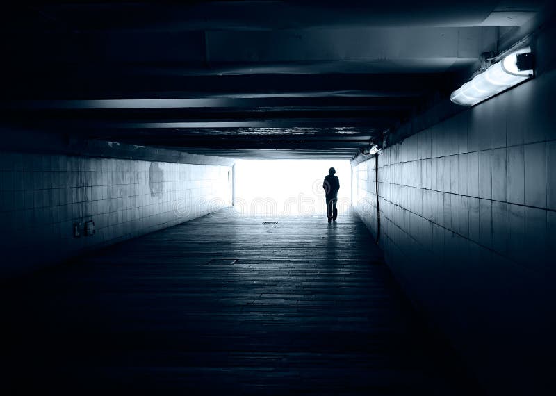 Lonely silhouette in a subway tunnel