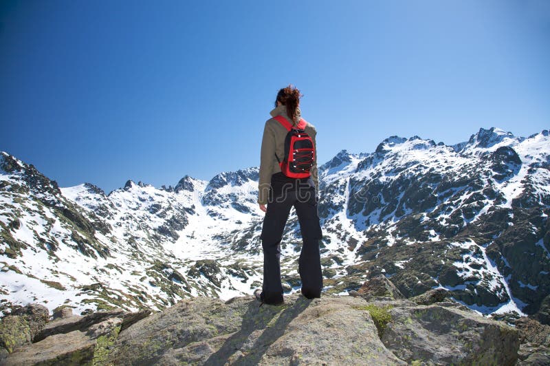 Lonely woman at the mountain royalty free stock photo