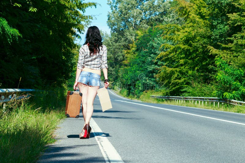 Lonely Young Brunette Woman Walking on the Side of the Road with Stock ...