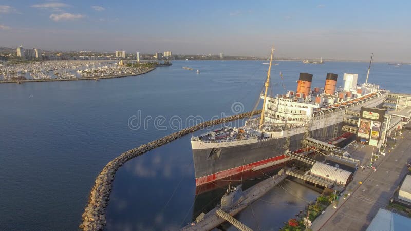 LONG BEACH, CA - JULY 2017: Aerial view of Queen Mary, a famous tourist attraction in California. LONG BEACH, CA - JULY 2017: Aerial view of Queen Mary, a famous tourist attraction in California.