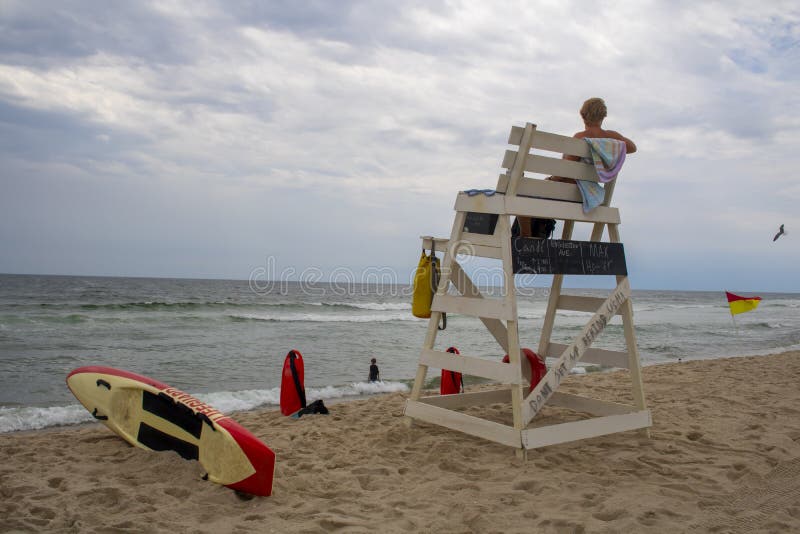 Long Beach Island, New Jersey, USA, 02-25-20 Summer day at the beach Lifeguard and tower with sunny sky with rescue can and fins