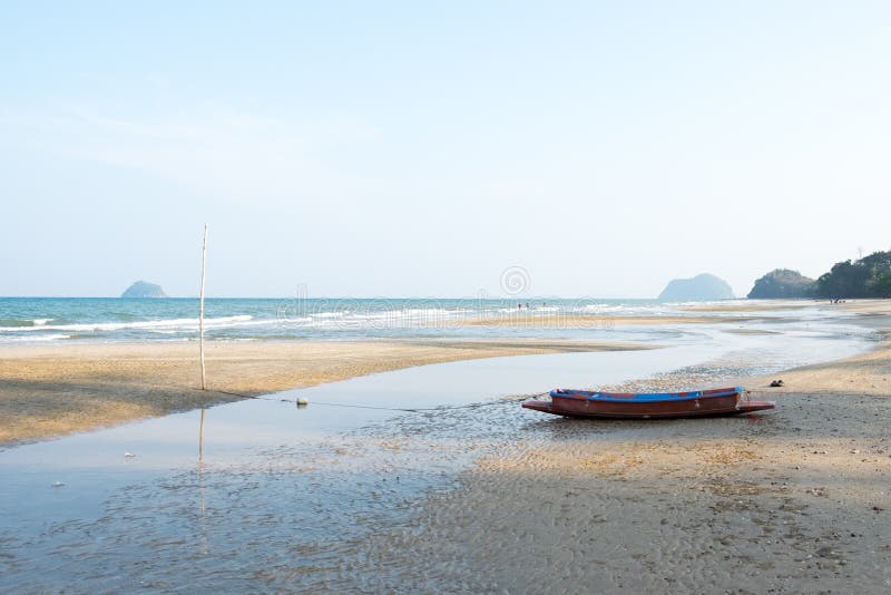 Long Beach View on Sunset with Fishing Boat. Stock Photo Image of