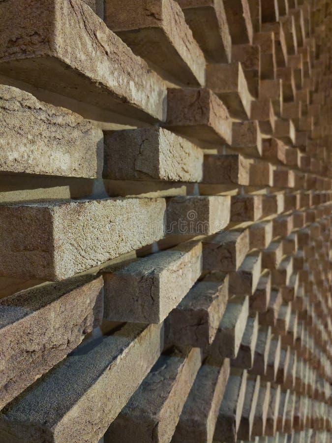 A Long Brick Wall in Perspective. Bricks are Laid Out in a Pattern with