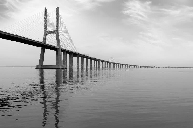 Long Bridge at sunset in Lisbon, Portugal. monochromatic picture