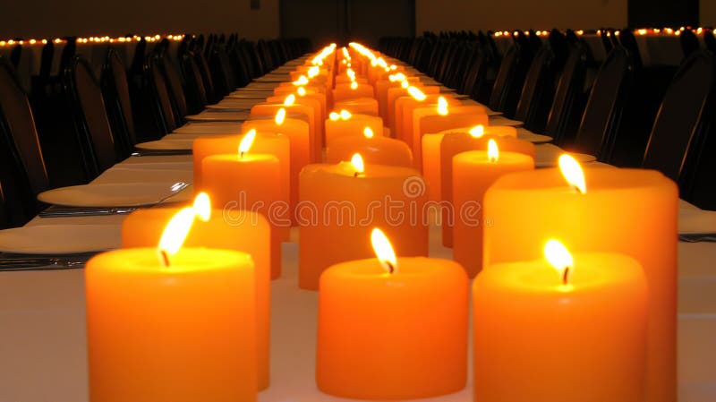 Long candlelit dinner table, event hall, celebration royalty free stock photography