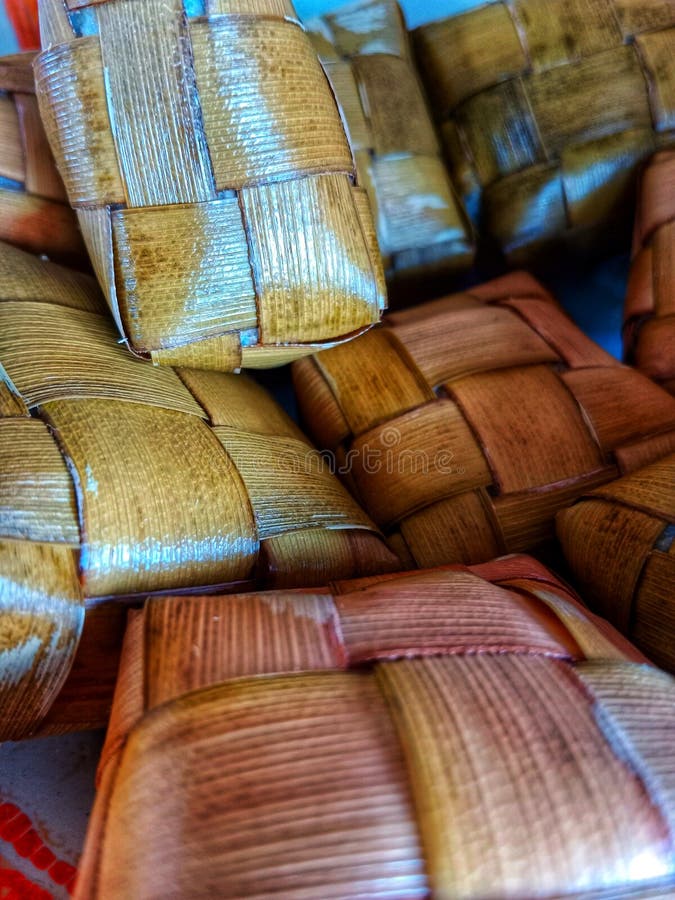 Long Cooked Rice To Soften and Wrapped in Coconut Leaves Stock Image