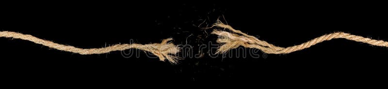 Long dirty rope, frayed at both ends and snapped in two. Concept of dangerous stress or stressful situation like divorce